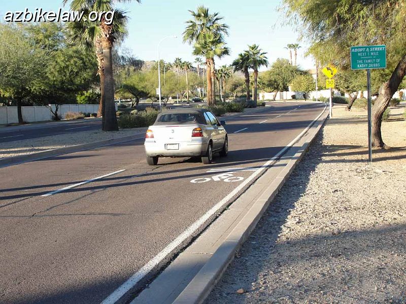 DSC01569.JPG - New (test?) sharrow 48th st (technically, it's actually guadalupe rd, see map) SB just S of Guadalupe Bridge . Note that a small car can readily fit between the marking in the centerline. This pretty much defeats the intention of the sharrow (which is to properly position cyclists in the middle of a narrow lane).photo taken 1/1/2012                        
