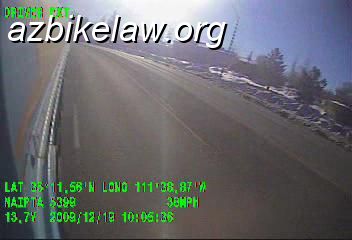vlcsnap-2140463.JPG - Bus left side rearward view showing bus within lane. It also shows an apparently clear left lane, meaning the driver was either mistaken or lying when he said he "couldn't" change lanes.