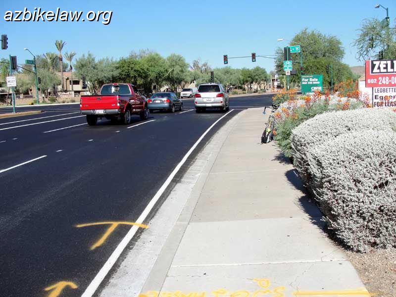 RayNostripe1.jpg - Westbound Ray Road, just before Ranch Circle South, Phoenix, AZ. This stretch (between 44th St) formerly had an onerous edge stripe. The stripe was removed, in this small stretch, when that part of Ray Road was resurfaced in June 2010.